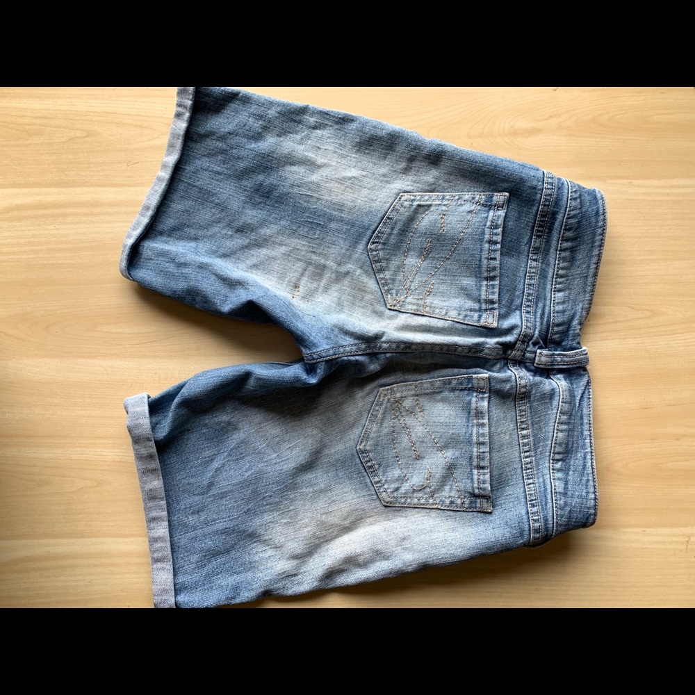 Mid length light wash denim shorts